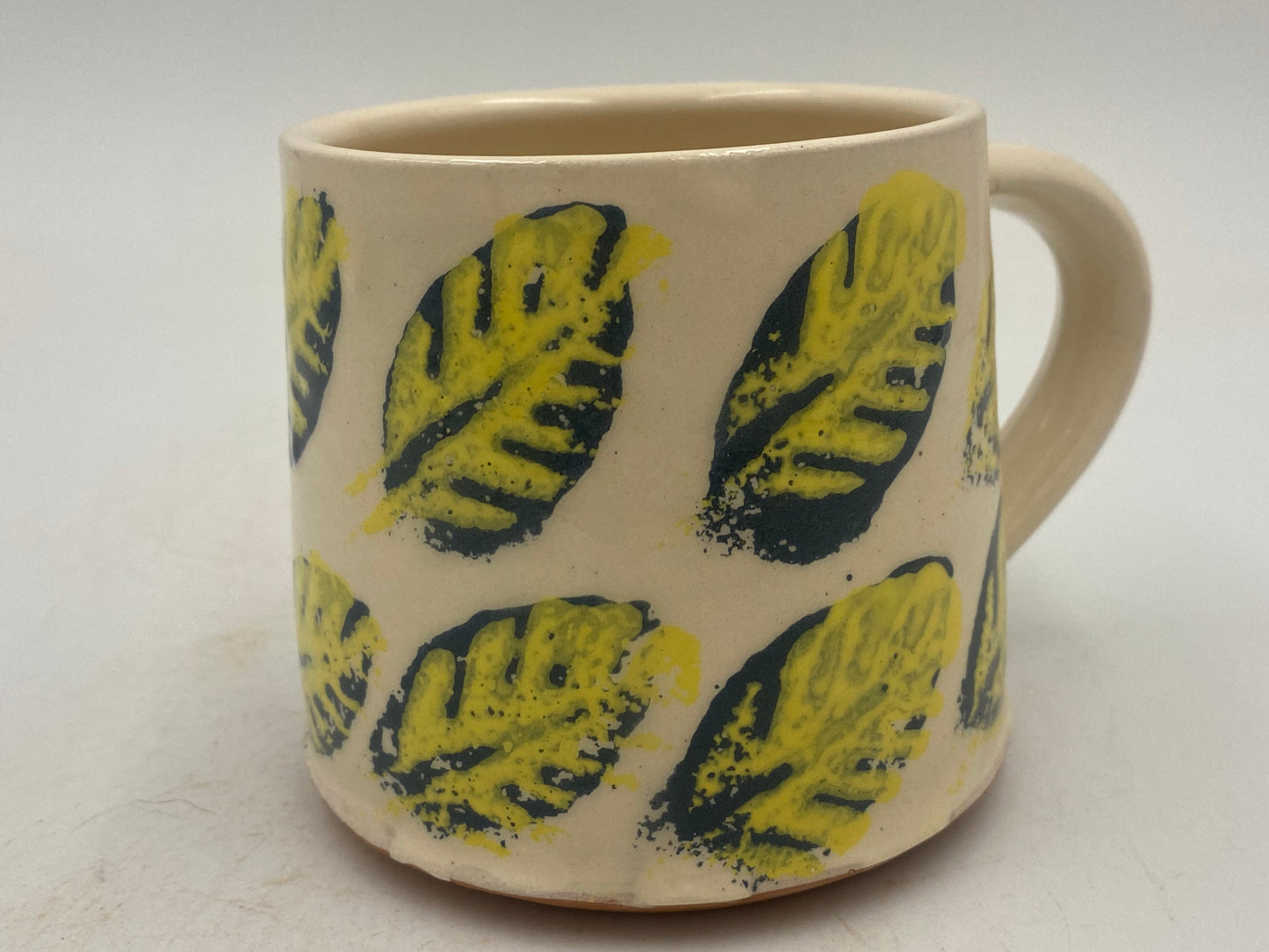 Yellow and blue leaf Mugs