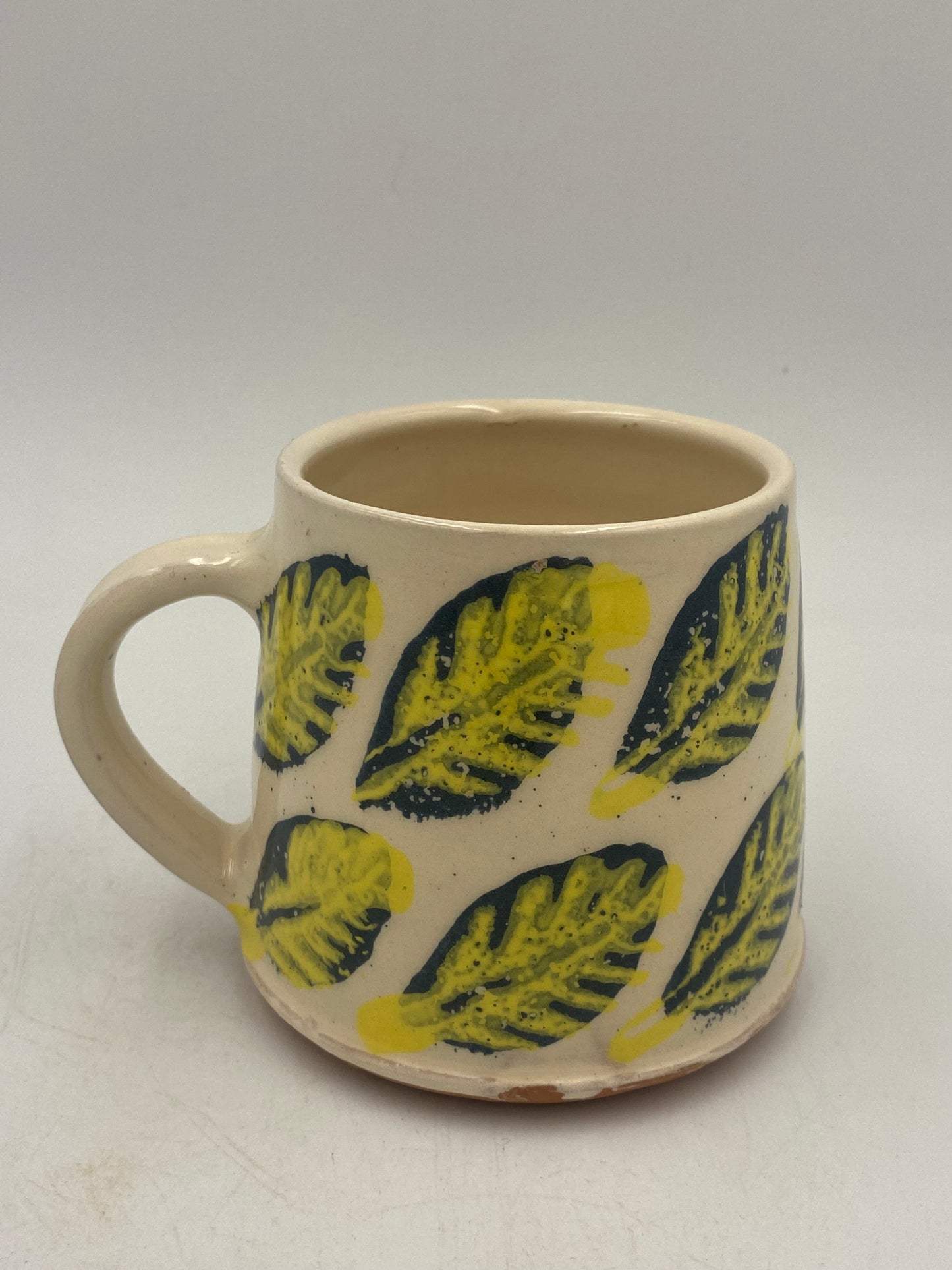 Yellow and blue leaf Mugs