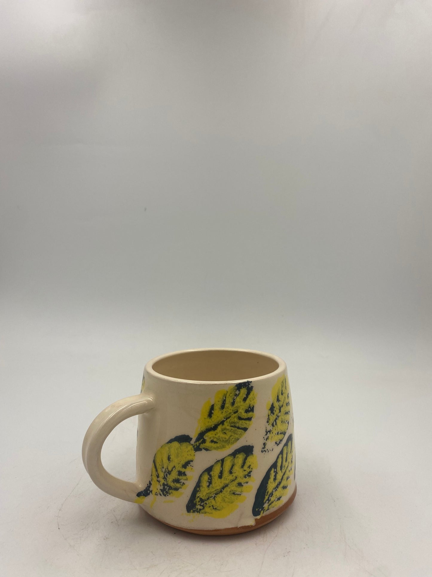 Yellow and blue leaf Mugs