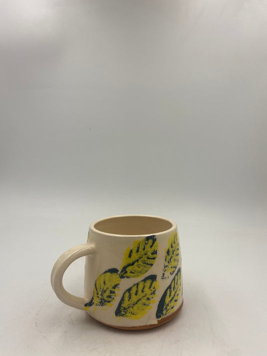 Yellow and blue leaf Mugs