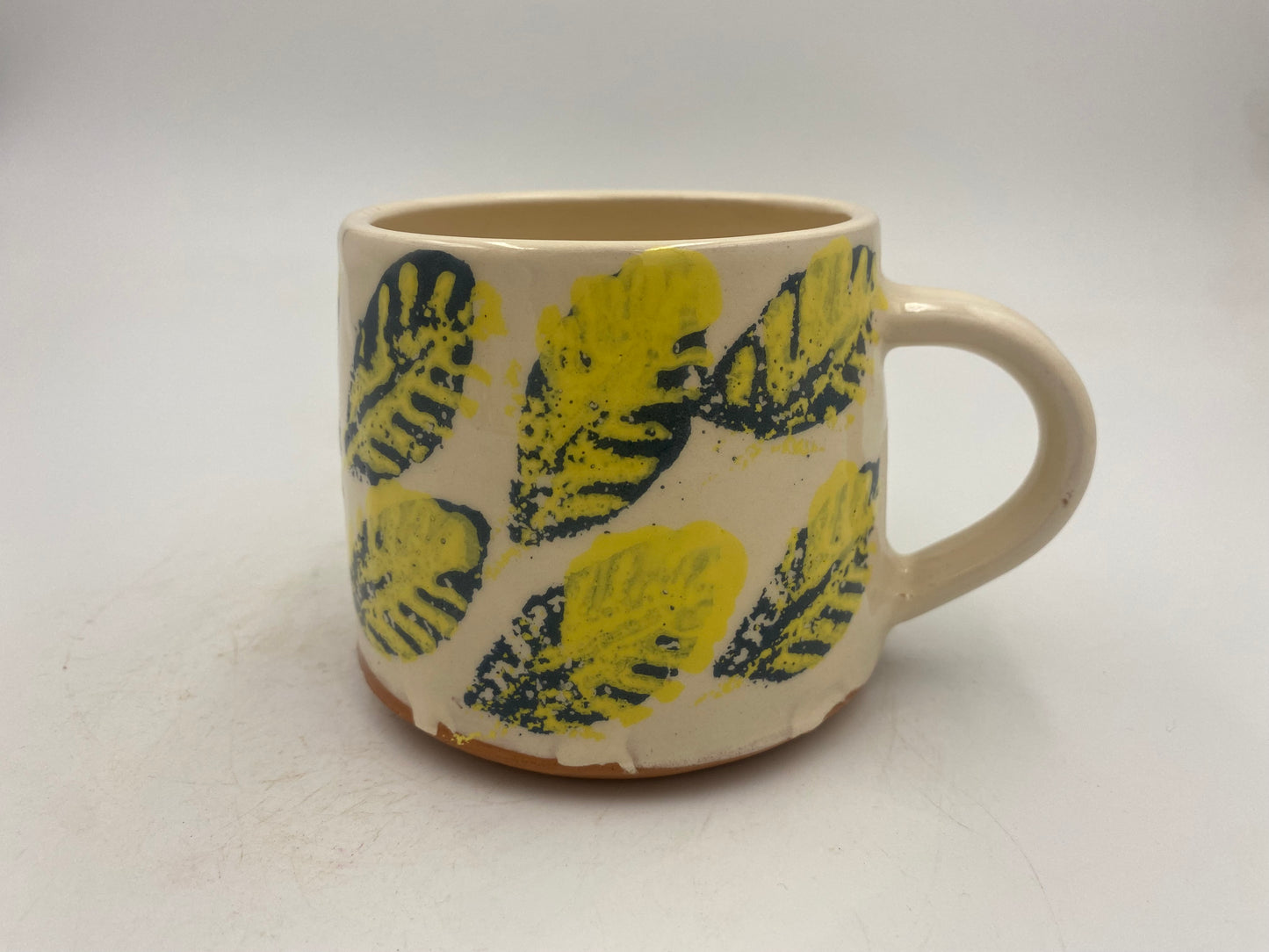 Yellow and blue leaf Mugs