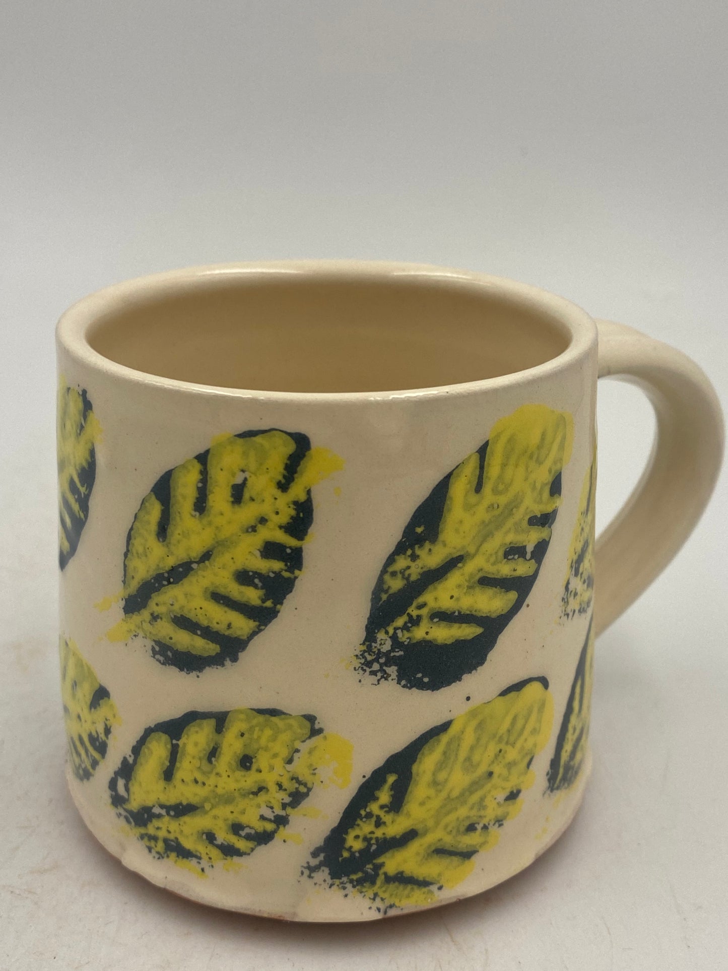 Yellow and blue leaf Mugs