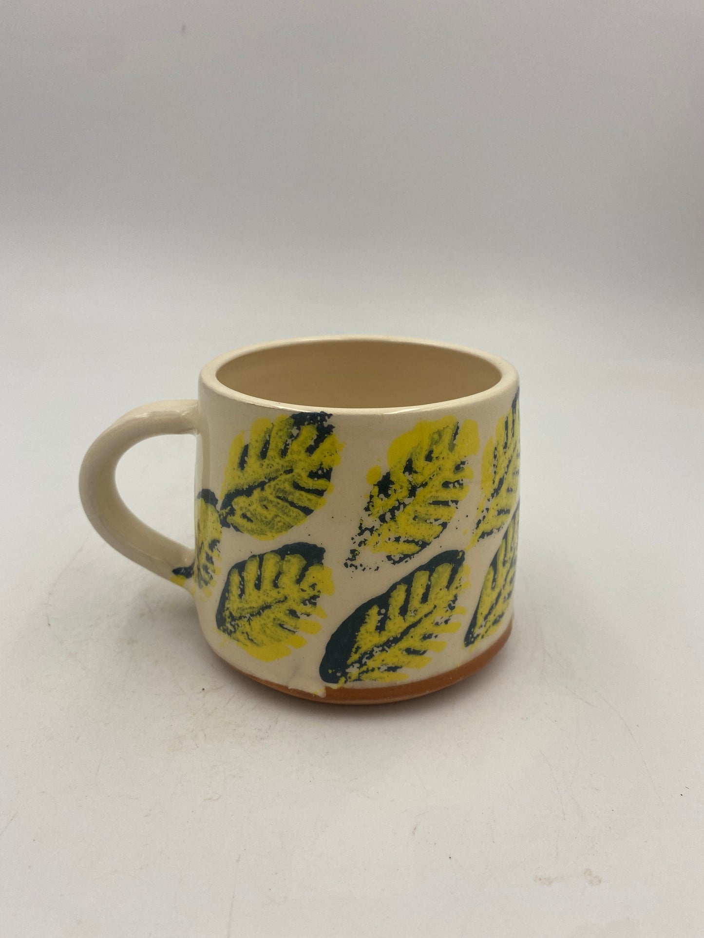 Yellow and blue leaf Mugs